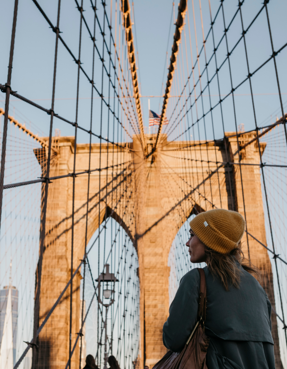 Photo of a woman on Brooklyn Bridge, NYC